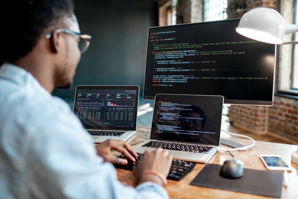 Developer working on multiple screens